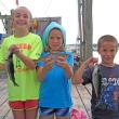 Sydney, Courtney and Drew Meader hold their winning pollock. Courtesy of Steve Rubicam