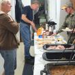 Assistant Chief Roger Whitney makes home fries while fellow volunteer firefighter David Seigers supervises. JOHN MAGUIRE/Wiscasset Newspaper