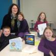 Eason's children, from left, Alex, 11; twins Mia and Callan, seven, Zoë, nine, and Carrie above in the upstairs Community Room where classes will be held. LISA KRISTOFF/Boothbay Register