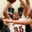 Dylan McMahon pulls down a rebound in Wiscasset’s game with St. Dom’s on Wednesday. Courtesy of Brion Controvillas