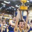 Seahawks co-captains Ian McConnell and Bob Deetjen raise the gold ball high as the 2001 Seahawks champions celebrate their state title at the Bangor Auditorium.