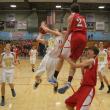 Anthony DiMauro slices through the lane and past the leaping Dale Peaslee to score two of his game-high 19 points. KEVIN BURNHAM/Boothbay Register