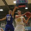 John Hepburn works hard to get off a shot against Dylan Price. Hepburn scored 20 points to lead Boothbay over Madison. KEVIN BURNHAM/Boothbay Register