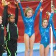 Boothbay gymnast Colette Perry, center, winner of the Level 4, 10-plus division at the Bath gymnastics meet February 3. Courtesy of Gina Perry