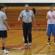 Coach Dana Lawrence, center, works on conditioning with J. D. Souza, left and Austin Haskell, right, at a December 2012 practice. KATHY ONORATO/Wiscasset Newspaper