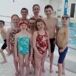 Dolphin Swimmers 9 & 10 year olds who attended the YMCA New England Championship Meet at Springfield College in Springfield, Mass., this past weekend. Pictured from left to right, back to front: Zoe Eason, Chris Hamblett, Ella Yentsch, Ben Pearce, Rowan Kristan, Callan Eason, Jaimie Labrecque, and Maren Whitney. Courtesy of YMCA