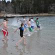 Swimmers run into the ocean at Hendrick's Head Beach in Southport March 14. BEN BULKELEY/Boothbay Register