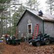 Spring 2005: Almost 50 years to the day from when construction first commenced, club volunteers gather to install a much needed new roof on their club house. Courtesy of Lucy Schmidt