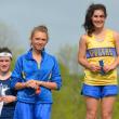 Sophia Thayer, right, and Hannah Morley, center, meet at the winners' podium at the MVC Championships in Augusta. The two teammates had a friendly rivalry all season, and will now advance to the state championships to compete in the 1600 and 3200 meter races on June 1. Courtesy of Aquilino Alamo  