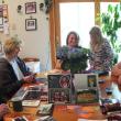 The family of Dane Bonang looks through photos and reminisces about his life. Left to right are: his parents, Allan and Mary Bonang; his cousins Beckie and Kendra Alexander; his brother Stephen Bonang; and Jordan Fitch. KATHY ONORATO/Wiscasset Newspaper