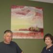 Allen Bunker stands in front of one of his paintings and beside First Federal branch manager Jean Huber. Courtesy of Sandy Terry