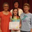 Emily Harris is surrounded by, from left, Madeline Olney (guidance counselor), Lisa Clarke (principal) and Carol Leone (mother of the late Sara Leone). Courtesy of Edgecomb Eddy School