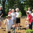 Scott Rittall, front, with help from the volunteers behind him, completed the planting of the community garden at Rittall Farm on Route 27 in Boothbay on June 15. Courtesy of Sarah Foulger