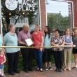 Taking part in a ribbon-cutting on July 1 at Mac's Place are, from left, Wiscasset Selectmen's Vice Chairman Judy Colby with granddaughter Dezirae Colby, Le Garage owner and Wiscasset Area Chamber of Commerce board member Cheryl Rust, Selectmen's Chairman Ed Polewarczyk, Mac's Place owner Karen McDorr, McDorr's daughter Danielle Sylvain, Selectman Pam Dunning, Town Planner Misty Parker and chamber board member Michelle Peele. SUSAN JOHNS/Wiscasset Newspaper