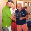 Winner of the Maine State J-24 Championship held last weekend at the Boothbay Harbor Yacht Club  is Carter White, left, holding the trophy and being congratulated by PC Andy Holmes, regatta Chair, and Commodore Neil Newton. Courtesy of Donald Snyder