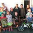 Winners and door prize recipients in the 9th Annual Boothbay Region Fish & Game Association Saltwater Fishing Tournament pose for a group photo behind young Danny Gray, who won the top Junior Division door prize of a brand-new stunt bicycle. Photo by Barry Gibson