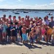 Competitors in the Arthur Hale Veasey Memorial Regatta gather on the Squirrel Island beach following the awards ceremony. Courtesy of Larry Sirois