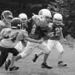 Camden Miller runs the ball against Medomak. Courtesy of Molly Barter