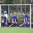 Goalie Tori Morin and Elise Mead, Elizabeth Ham and Gabby Staples prepare for a penalty corner. Courtesy of Michelle Bouchard