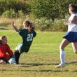 Goalie Jamie Wheeler scoops up the ball from a Carrabec striker during the home game on October 1. Wheeler had 19 saves. RYAN LEIGHTON/Boothbay Register