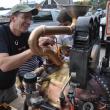 Jacques Vesery, left, Jonah Vesery, center and Minda Gold, right, all work Friday, Oct. 11 on “Steampumpkin” on Main Street in Damariscotta. With Pumpkinfest this weekend the Twin Villages have filled with pumpkins and tourists. BEN BULKELEY/Boothbay Register