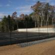 The fence is up, temporary lines are down but the new tennis courts on the Boothbay Harbor school campus won’t be ready to use until spring. KEVIN BURNHAM/Boothbay Register