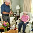 Selectman Gerry Gamage presents Evelyn Luther Pratt Sherman with the Boston Post Cane. Robert Mitchell photo 