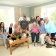 Evelyn Luther Pratt Sherman holds the Boston Post Cane surrounded by her family — Kali Andrews, Cory Chase, Anne Thompson Maher (cousin), Jack Sherman (grandson), Jerry McGrail (son-in-law), Mary Lou Thompson Koskela (cousin), Jake Brewer (grandson), Sarah Sherman (daughter), and Susan Jellison (daughter). Robert Mitchell photo