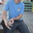 The shucking contest winner shows off his knife. 