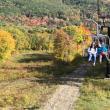 People riding the Snow Bowl chairlift.