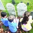 Wyatt Underwood, William Marshall, Paizley Marr explore a gravestone. Emma Rossignol photo