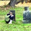 Kali Gallloway scooches as she takes notes at a gravestone. Becky Hallowell photo 