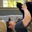 Eric Hutchinson helping to socialize a cat at Mid Coast Humane in Brunswick. ECB photo