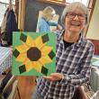 Rita Arnold and her sunflower. Courtesy of Saskia Reinholt