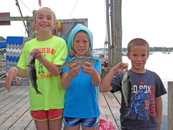 Sydney, Courtney and Drew Meader hold their winning pollock. Courtesy of Steve Rubicam