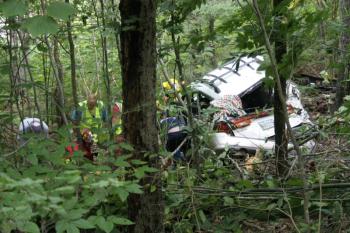 Rescuers tend to an injured person involved in Friday afternoon's accident on Butler Road, Boothbay.