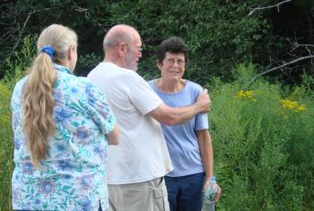 Brigit Britton of Boothbay gets a hug from husband Eric Traphagen after she was rescued from Trout Brook Preserve in Alna. SUSAN JOHNS Wiscasset Newspaper