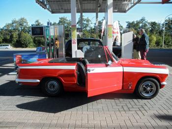 Bruno and Cécile's red, roofless '65 Triumph Vitesse.