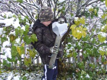 Evan Wells makes sure the family feeders are well stocked for winter visitors. Courtesy of Allison Wells