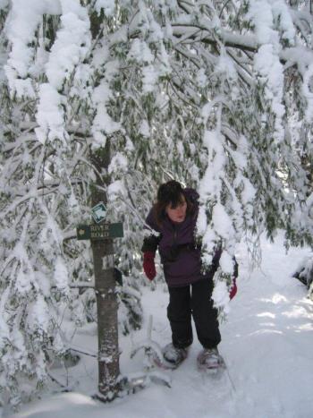 Preserve Steward Cheryl Lorrain snowshoeing on Zak Preserve.