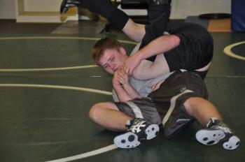 Howard Carter, left, puts Coach Don Waltz into a hold. BEN BULKELEY/Boothbay Register