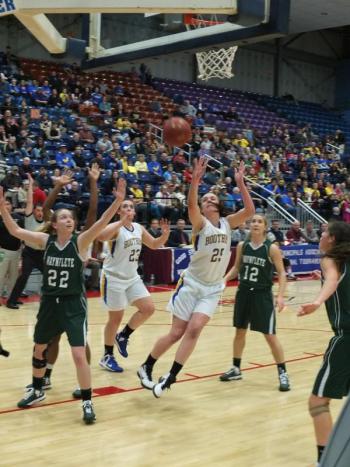 Senior captain Alex Clarke puts up a shot against Waynflete as co-captain Allison Crocker looks on. RYAN LEIGHTON/Boothbay Register