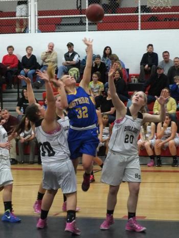 Sophomore Morgan Crocker slices between two Hall-Dale defenders to get off a shot during Tuesday's game in Farmingdale. Crocker led all scorers with 12 points. RYAN LEIGHTON/Boothbay Register