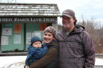 Maria Jenness, Travis Journagan and baby Roy at the Land Trust’s Penny Lake Preserve before an afternoon walk. SUE MELLO/Boothbay Register