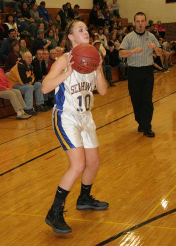 Sarah Caron lines up a three-point shot during a game at BRHS in 2012. KEVIN BURNHAM/Boothbay Register