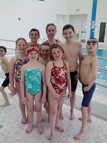 Dolphin Swimmers 9 & 10 year olds who attended the YMCA New England Championship Meet at Springfield College in Springfield, Mass., this past weekend. Pictured from left to right, back to front: Zoe Eason, Chris Hamblett, Ella Yentsch, Ben Pearce, Rowan Kristan, Callan Eason, Jaimie Labrecque, and Maren Whitney. Courtesy of YMCA