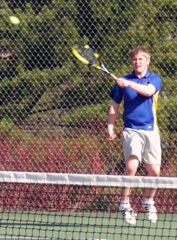 Senior Brady Duncan elevates for this return against Wiscasset's Tom Anderson. KATHY ONORATO/Boothbay Register