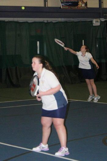 Angela Machon serves as doubles partner Dana Greenleaf watches their Wiscasset opponents. Boothbay won the match in a tiebreaker, 11-10. KEVIN BURNHAM/Boothbay Register