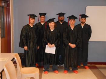 Receiving GED diplomas while inmates at Two Bridges Regional Jail are, left to right, Josh Amaral, Casey Corbett, Samantha Tucker, Daniel Soto, Joshua McInnis and Ian Walsh. Courtesy of Two Bridges Regional Jail