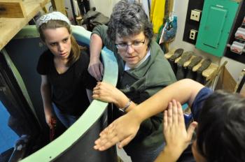 From left, Anna Sirois, Susan Amundsen and Kim Picard discuss their vision for the debris tank. BEN BULKELEY/Boothbay Register